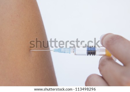 Doctor give injection to caucasian man arm