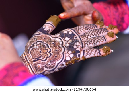 Indian Couple, Bridal Hands  and legs, Mehndi, Wedding day, Hindu marriage. Wedding Cake,wedding dress for bridal and groom.