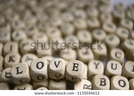 cubes letters love inscription / message from small letters, the concept of romance love, inscription love unusual font