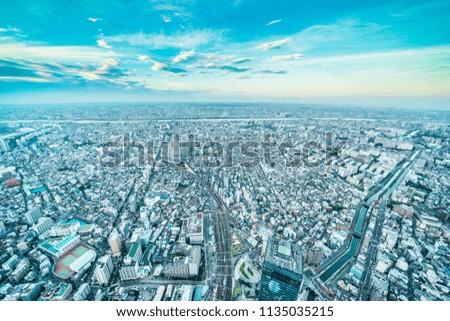Asia Business concept for real estate and corporate construction - panoramic urban city skyline aerial view under twilight sky and golden sun in tokyo, Japan