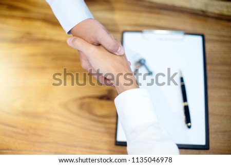 Business man handshake for sucess agreement concept realestate contact with more copyspace 