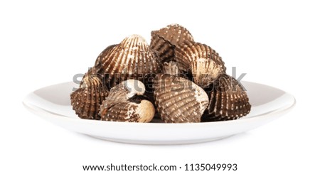 dish of Delicious boiled or steamed cockles isolated on white background