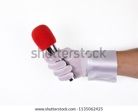 hand holds a microphone on a white isolated background