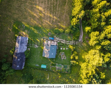 Aerial landscape with house in nature. Calm place in forest.