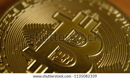 Macro photo of gold bitcoin, soft focus. Royalty high quality free stock image of metal bitcoin. Bitcoin is a cryptocurrency, a form of electronic cash
