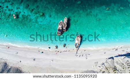 Aerial view from a mediterranean beach with tourist boats