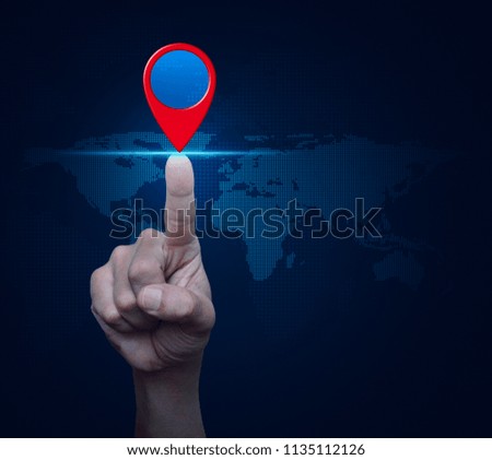 Hand pressing map pin location button over digital world map, Map pointer navigation concept, Elements of this image furnished by NASA