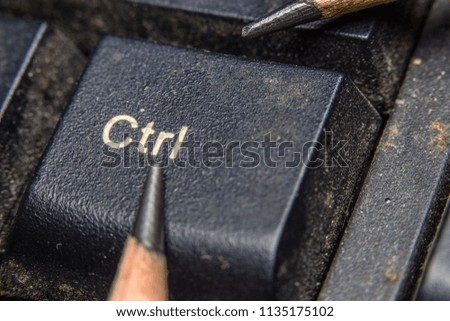close up. wooden pencil placed on a computer keyboard.photo with copy space