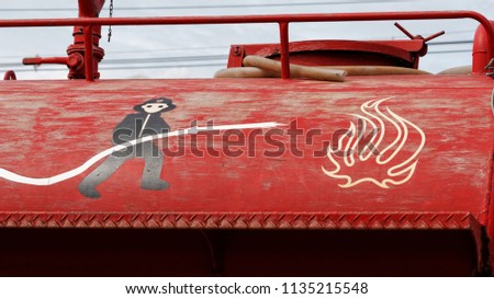 fireman cartoon on red fire truck