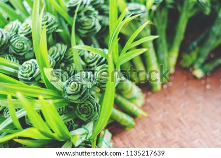 Fresh bouquet from green pandan leaves in rose shape for worship the buddha
