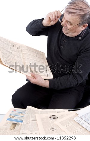 Senior reads newspaper