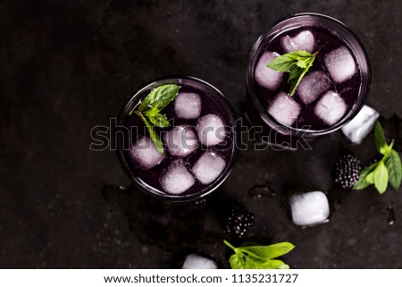 Summer cocktail. Drink with blackberries. Blackberry drink.