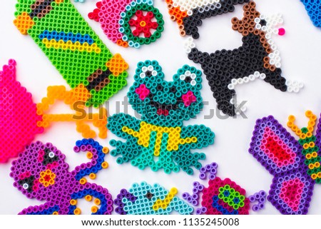 Easy perled bead animals. Gather of animals, flat lay, top view.