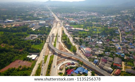 Aerial view of highway interchange in Songkhla southern Thailand on nice day background,Top view photo from drone flight background.