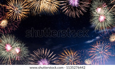 Beautiful fireworks with stars in the sky background