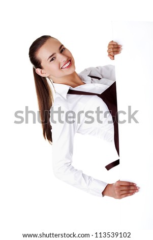 Waitress in elegant shirt and apron holding blank board