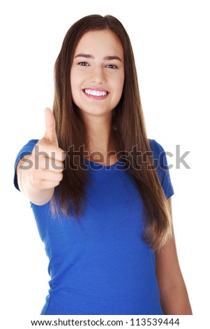 Beautiful young woman in casual clothes gesturing thumbs up. Isolated