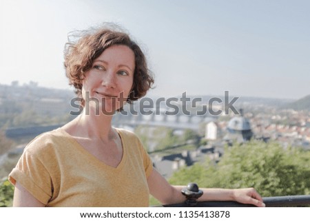 a woman  is walking around the city in the spring day. Europe. Prague 