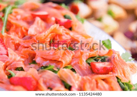 thin slices of freshsalmon fillet on a plate