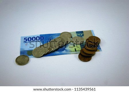 IDR banknotes and coins isolated. Indonedia Rupiahs cash money