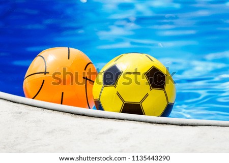 inflatable balls in the pool in the summer. travel, vacation, active sport holidays and weekends concept, summer sales