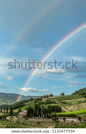 Panoramic Landscape View of Double Rainbow Over Italian Tuscany Countryside