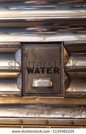 Water sign on a metal train