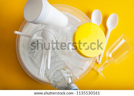 No Plastic Recycle Concept Whitel Plastic Dishes Plates Cups Spoon Isoalted Yellow background Copy Space Top View Royalty-Free Stock Photo #1135530161