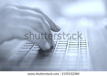 female fingers on the laptop keyboard black and white                               