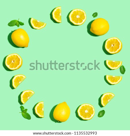 Fresh lemon circle on a pastel green background flat lay
