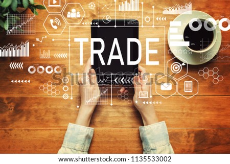 Trade with a person holding a tablet computer