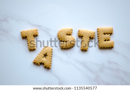 TASTE written with biscuits
