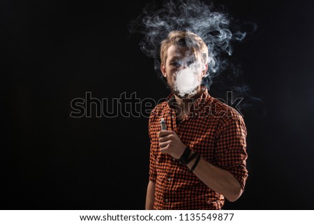 A young man with a beard and a stylish hairstyle in a shirt, smoking a cigarette, a viper, a room, a studio, smoke, enjoyment