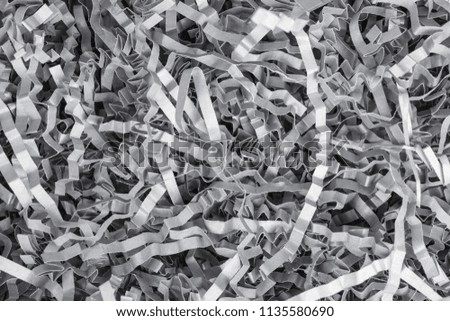 background of gray shredded paper