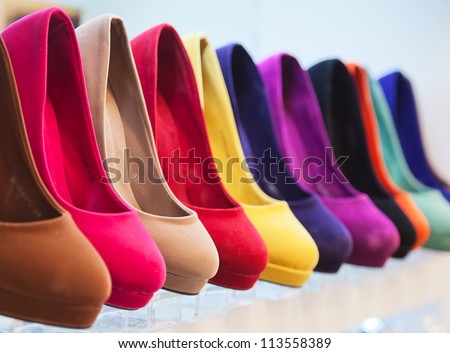 variety of the colorful leather shoes in the shop Royalty-Free Stock Photo #113558389