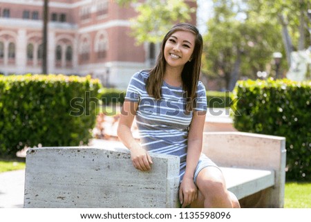 Casual, sincere, natural pose from pretty conservative female youth enrolled in school