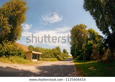 Bus stop on a summer sunny day in the village.