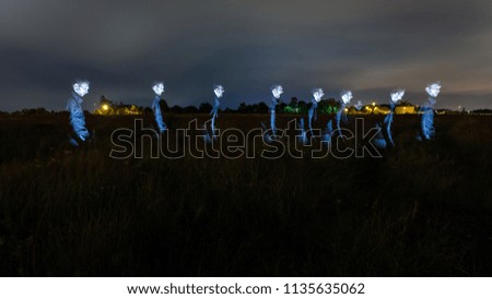 ghostly silhouette of a man at night at a long exposure