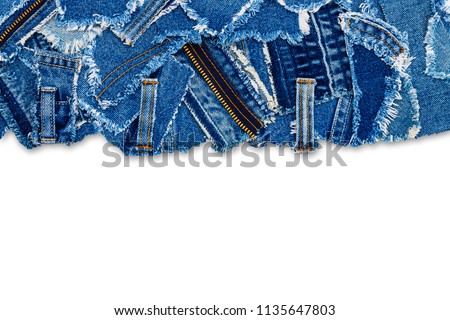 Denim blue jeans fabric frame. Ripped denim patch, text place, copy space.  Washed denim fabric with fringe edge. 