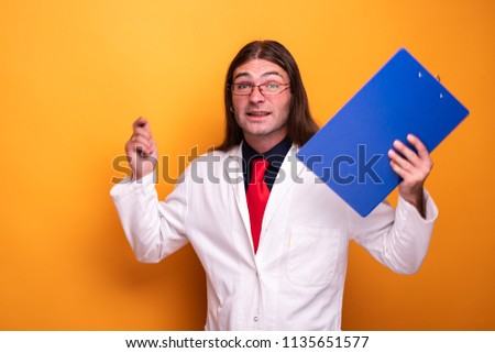 Portrait of male doctor encouraging displaying an expression behind his glassses