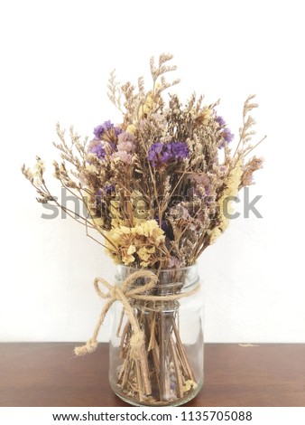 Colorful dried wild flowers in vase, dry flower vintage style Royalty-Free Stock Photo #1135705088