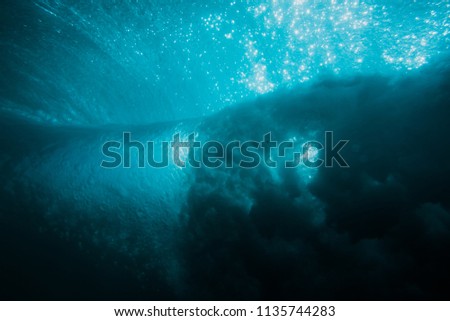 Beautiful barrel wave is underwater in sea