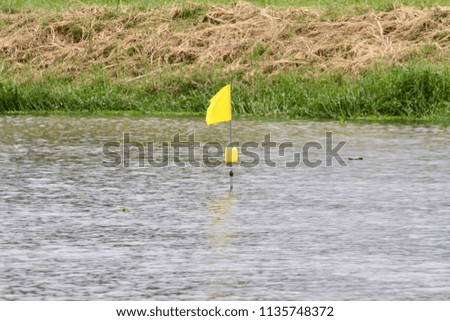 Flag on the river. The target and goal of the dragon boat race.