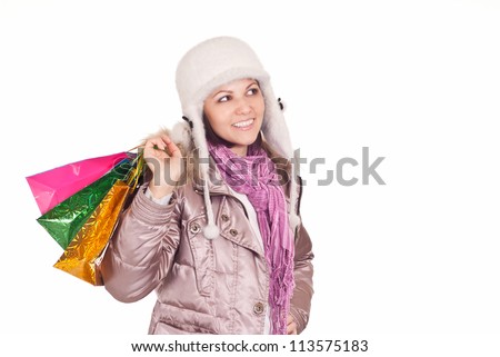 cute young woman with christmas gifts on white
