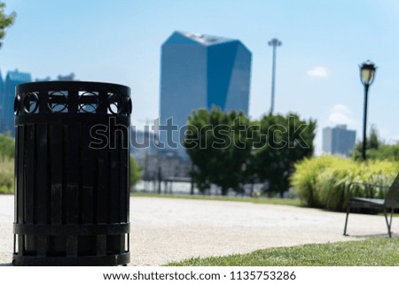 Philadelphia Skyline with Clean Park Trash Can in Foreground