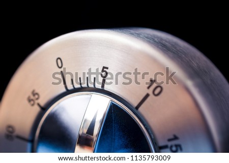 5 Minutes - Macro Of An Analog Chrome Kitchen Timer With Dark Background Royalty-Free Stock Photo #1135793009