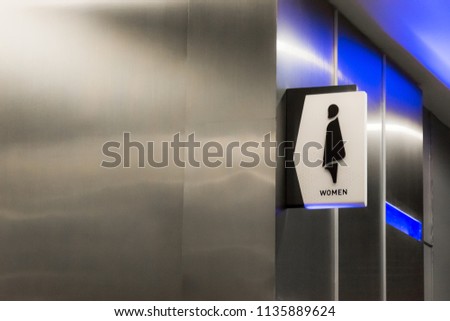 Toilet icons set. Men and women WC signs for restroom.Restroom sign on a toilet wall,on modern background.Toilet sign - Restroom Concept - black tone.