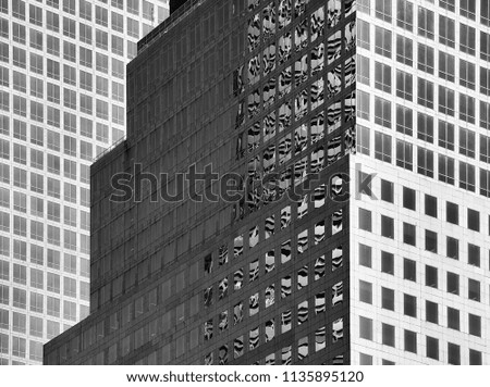 Black and white close up picture of modern architecture, urban background.