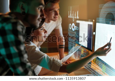 Programmers Working On Software In Office. Team Of People Coding New App. High Resolution Royalty-Free Stock Photo #1135913807