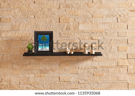 Holiday frame and shelf concept banner style with camera and object. yellow brick wallpaper interior.